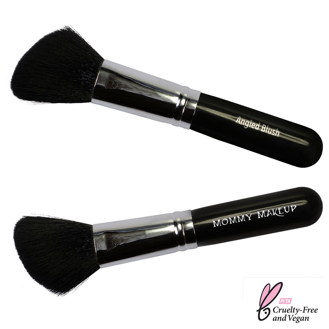 Two makeup brushes with black bristles and silver handles on a white background, labeled 'Angled Blush' and 'Mommy Makeup'.