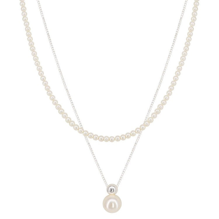 Two pearl necklaces on a white background