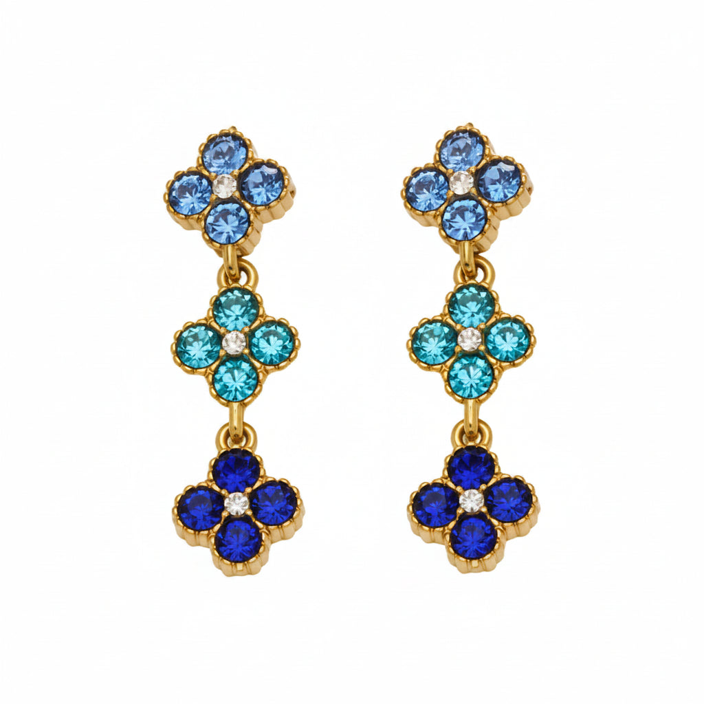 Pair of floral earrings with blue and gold details, labeled for materials and dimensions.