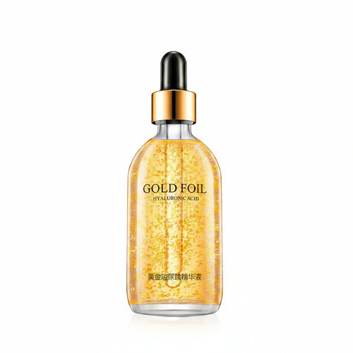 Gold foil serum bottle with dropper and packaging on a white background