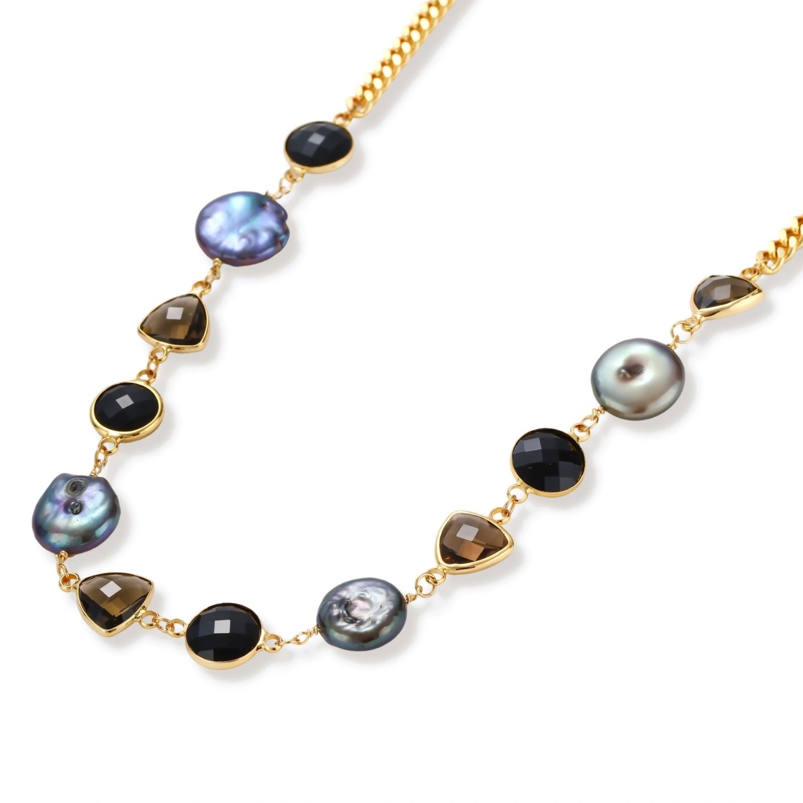 18k gold-plated chain necklace featuring lustrous baroque pearls, black onyx rounds, and smoky quartz triangular stones on white background.