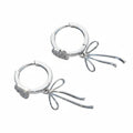 Micro-Pave Bow Drop Earrings — Heart Zircon Sterling Silver